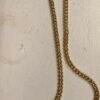24 INCH GOLD TONE STAINLESS STEELNECKLACE WITH AN ACE HIGH STRAIGHT FLUSH POKER HAND PENDANT