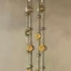 29 INCH STATION NECKLACE WITH METAL BEADS AND CIRCULAR AMBER RHINESTONES